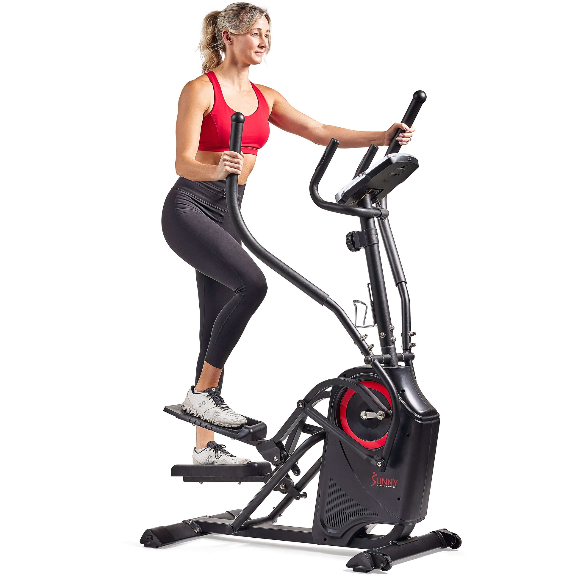 Woman exercising on Sunny Health & Fitness Premium Cardio Climber SF-E3919, combining step and elliptical workout.